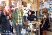 Tourists posing with Iranian women in Iran bazaar