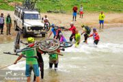 river crossing with mountain bike - Lar national park