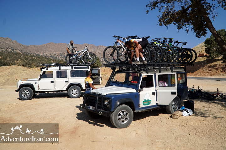 Unloading the mountain bikes of clients in Adventure Iran cycling tour
