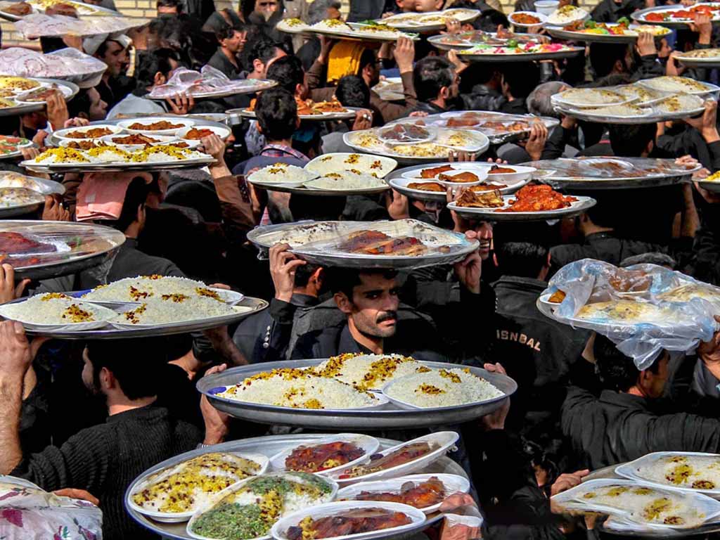 Men distributing food in Ashura Iran